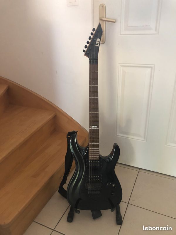 vends Guitare LTD ESP MH-50 avec en option accessoires et étui rigide